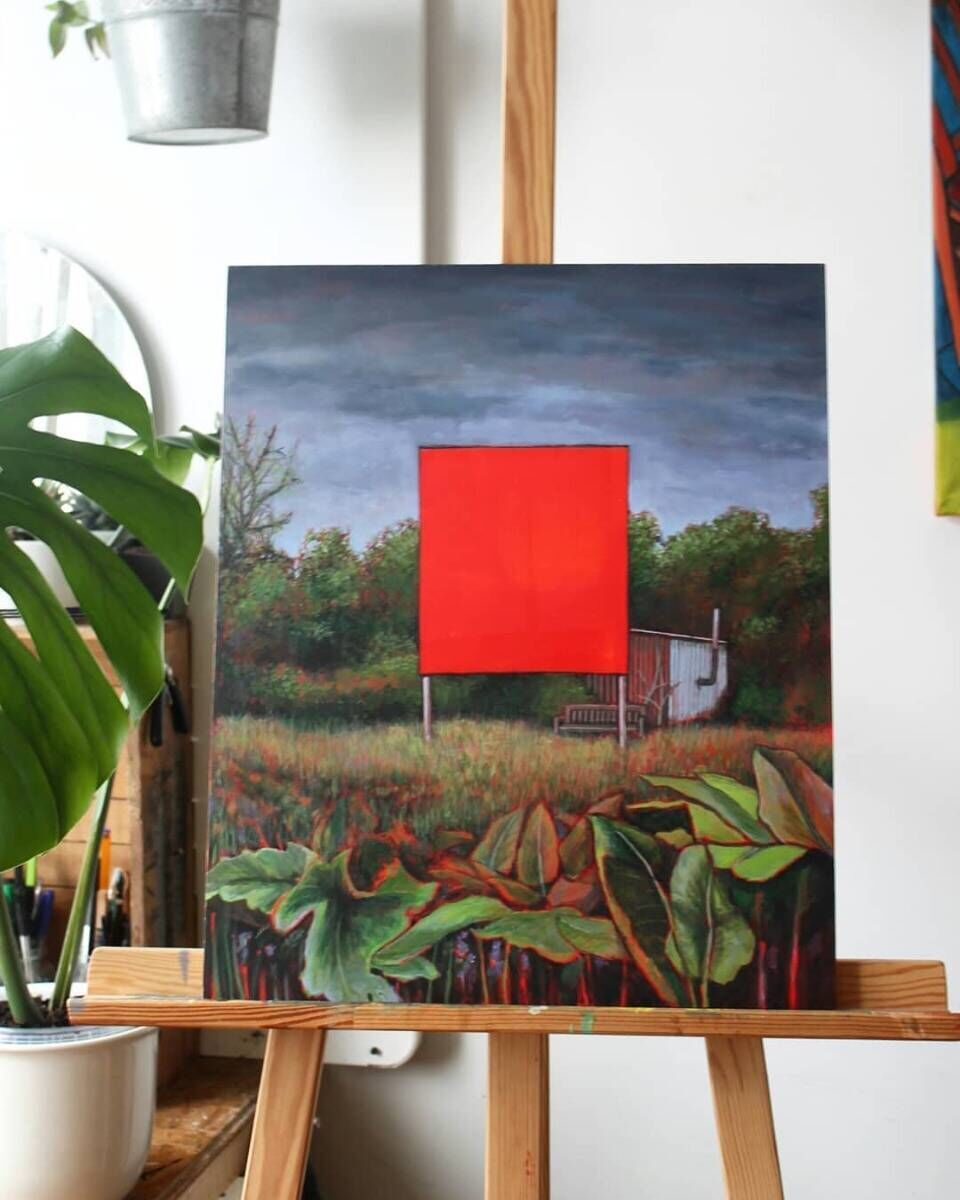 red billboard in nature